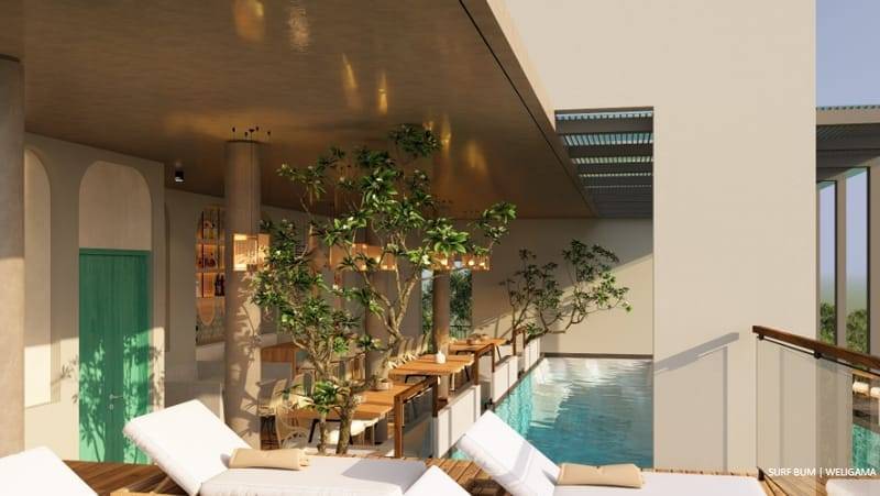 Pool deck with sun loungers beside the bar at Soul Surfer Camp, Weligama, Sri Lanka