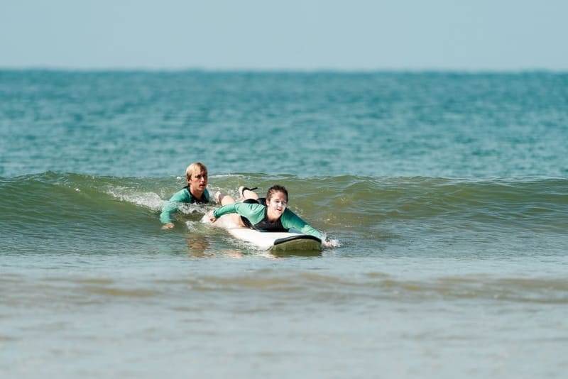 Beginner surf lesson in the shallows of Weligama Bay, Sri Lanka