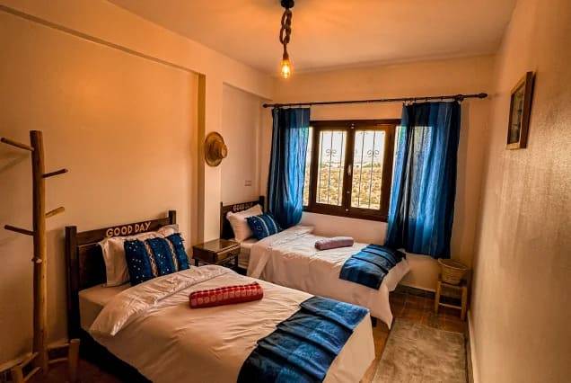 Twin beds in a shared room at The Surfer SurfStyle Camp, Tamraght, Morocco – photo 8