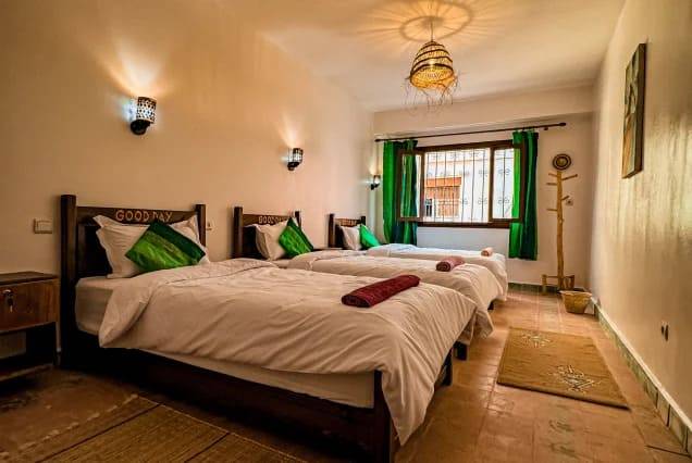 Twin beds in a shared room at The Surfer SurfStyle Camp, Tamraght, Morocco – photo 1