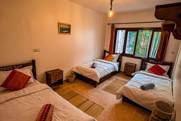 Twin beds in a shared room at The Surfer SurfStyle Camp, Tamraght, Morocco – photo 2
