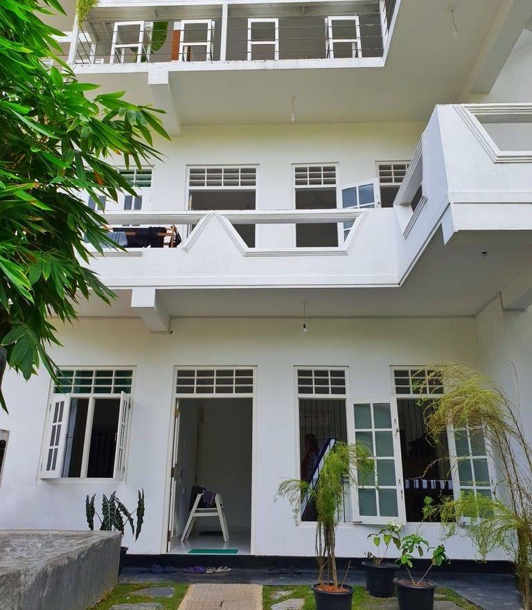 The white two-storey guest building at The Surfer TS2 Camp, Weligama, Sri Lanka