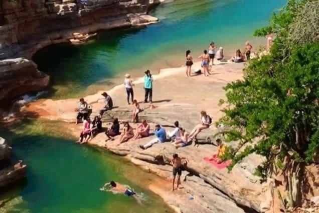 Swimmers at the turquoise rock pools of Paradise Valley in the Atlas foothills, Morocco