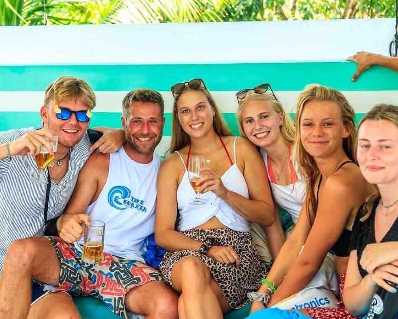 Guests sharing a drink on the terrace at The Surfer Beach Camp, Weligama