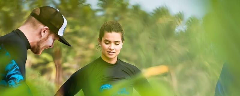 A Surfer coach and guest in The Surfer rash guards before a surf session at Weligama, Sri Lanka
